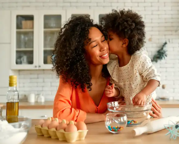 Mom and child enjoying happy moment of money freedom.